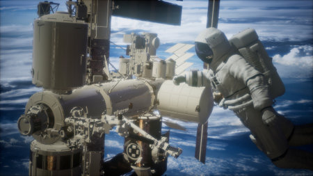 An astronaut conducts a spacewalk, floating gracefully outside a large space station. The backdrop features magnificent Earth below, showcasing the beauty of our planet from orbit.の写真素材