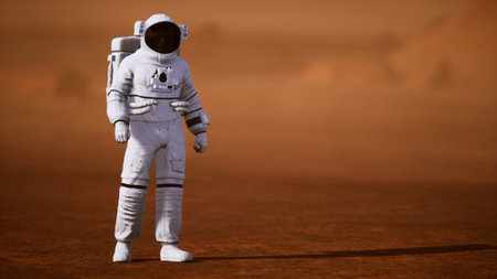 An astronaut stands on the rusty Martian surface, surveying the vast red terrain. This moment captures the essence of human curiosity and exploration beyond Earth, symbolizing hope and discovery.の写真素材