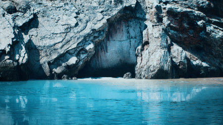 Bright turquoise waters reflect the morning light as they meet the jagged rock formations. The serene landscape invites a sense of peace and tranquility, perfect for contemplation.の写真素材