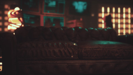 In a dimly lit room, a worn leather couch sits prominently, surrounded by glowing screens and...