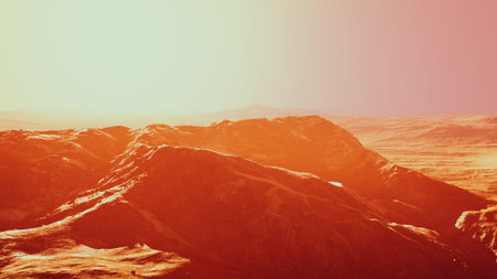 Golden light envelops a dramatic mountain range, accentuating the rugged terrain. The breathtaking view showcases the serene beauty of nature at dusk in a remote location.の写真素材