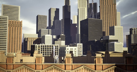 A vibrant city skyline features a mix of skyscrapers and historic structures under a cloudy sky. The contrast between modern and classic architecture highlights urban development.の写真素材
