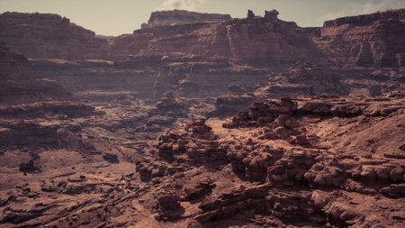 The vast rocky terrain showcases stunning geological formations under a clear sky, highlighting the natural beauty of the landscape during daytime exploration.の写真素材