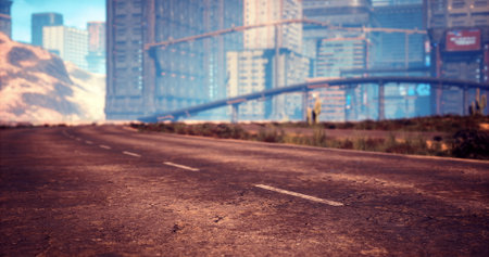 A long, empty road leads toward a vibrant city skyline under a bright blue sky. Distant skyscrapers rise alongside the road, showcasing modern architecture in a serene atmosphere.の写真素材