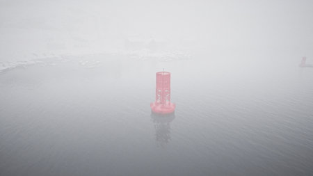 A red metal buoy floating in the middle of the cold Norwegian sea.の写真素材