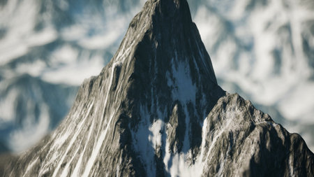 A breathtaking mountain peak towers above surrounding snow covered terrain, showcasing rugged beauty under a clear blue sky. Natures grandeur is on full display in this serene landscape.の写真素材