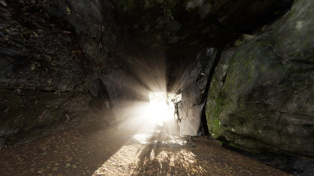 Sunlight streams through the entrance of a cave, creating ethereal light beams that dance on the...