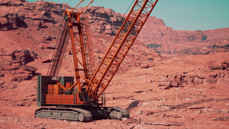 A massive crane stands tall in a barren desert, showcasing its intricate design. The equipment is...