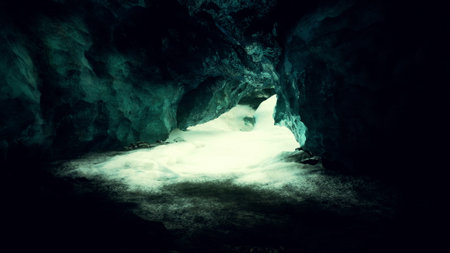 A tranquil ice cave reveals its enchanting features as soft light filters through. The icy walls...