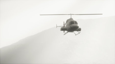 A sleek helicopter hovers silently in the air, surrounded by the soft embrace of misty mountains....