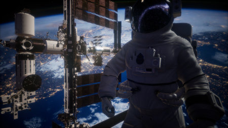 In the depths of space, an astronaut floats close to the International Space Station, with Earth glowing below as countless stars shine brightly against the dark backdrop of the universe.の写真素材