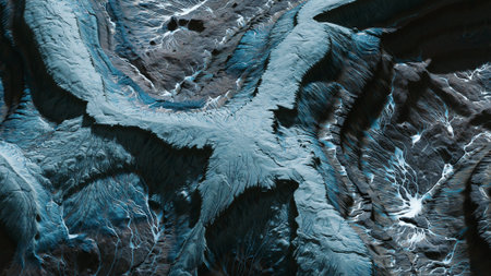 Breathtaking views showcase the intricate patterns formed by glaciers, flowing rivers, and jagged terrain. This remote location highlights natures creativity during changing seasons.の写真素材