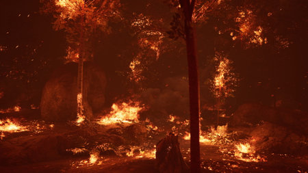 Flames consume trees and underbrush in a forest, creating a vivid spectacle. The air is thick with...