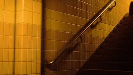 Warm light bathes the tiled walls and stairs, creating a serene and inviting environment. The scene...