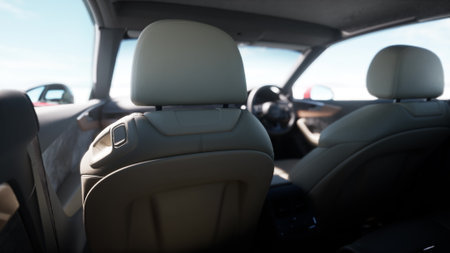 Soft leather seats frame a comfortable cabin as sunlight floods in through the windows. The open road invites exploration and adventure, promising a delightful journey ahead.の写真素材