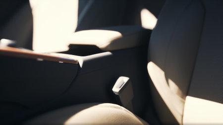 A soft light filters into the car, highlighting the beige upholstery and design details. The atmosphere feels calm and inviting, perfect for a quiet journey or a moment of reflection.の写真素材