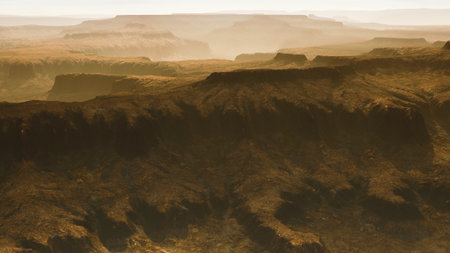 Sweeping views of a grand canyon stretch across the horizon, bathed in warm hues as the sun sets. Layers of rugged rock create a stunning tapestry in this tranquil landscape.の写真素材