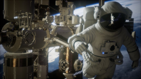 An astronaut in a white space suit performs a spacewalk beside the International Space Station....