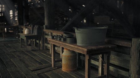 In an old workshop, wooden tables hold various tools and supplies, casting shadows on the weathered floor. The atmosphere is filled with a sense of history and craftsmanship.の写真素材