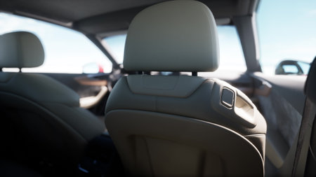 Soft leather seats and sleek design elements create a luxurious ambiance inside this modern car, highlighting comfort and contemporary style during a sunny day.の写真素材