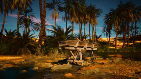 A tranquil scene unfolds with wooden chairs near still waters, surrounded by tall palm trees under a colorful dusk sky. Nature's beauty offers a perfect place for relaxation.の写真素材