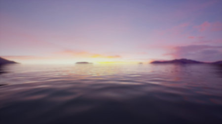 Gentle waves ripple across a tranquil lake as the sun sinks below distant mountains. The sky glows...