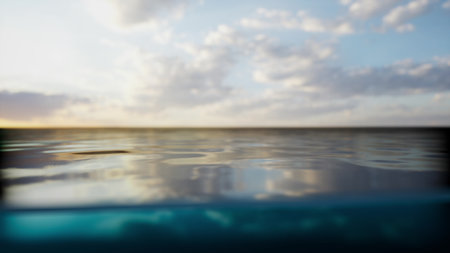 The calm water reflects the skys gentle colors as twilight approaches. Soft clouds float above, creating a peaceful atmosphere that invites relaxation and contemplation.の写真素材