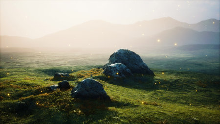 Dawn breaks over a serene landscape where majestic mountains rise in the distance. Glowing rocks scatter across vibrant green grass, creating a magical and peaceful atmosphere inviting exploration.の写真素材