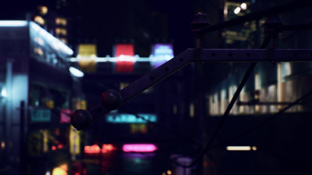 A quiet alley glows with colorful lights from surrounding buildings in the late evening. Shadows and reflections mix, creating a lively yet mysterious urban atmosphere.の写真素材