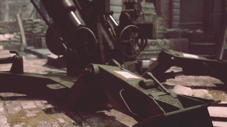 Rusty and weathered artillery equipment stands silently among rubble, showcasing a forgotten era of conflict. Sunlight filters through the debris, hinting at untold stories.の写真素材