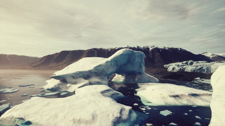 In a serene landscape, large ice formations float on calm waters, reflecting the beauty of nature....