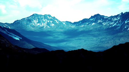 Dramatic peaks rise against a twilight sky, their rugged surfaces illuminated by a soft blue hue....