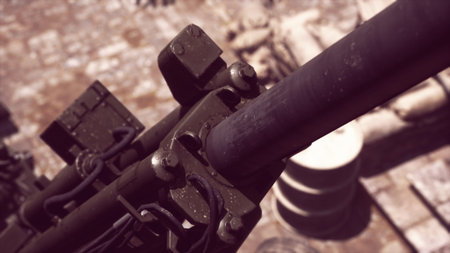 A close up view reveals the craftsmanship of a historic cannon, resting on a cobblestone surface....