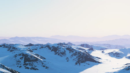Snow capped mountains stretch across the horizon, bathed in a gentle morning light. The serene landscape showcases natures beauty at dawn, evoking peace and awe.の写真素材