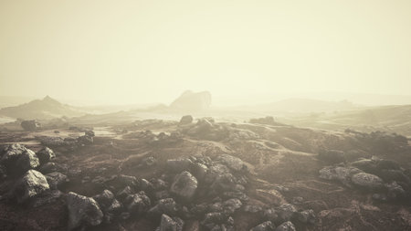 A surreal view of an otherworldly landscape filled with rugged rocks and soft hills. The atmosphere is hazy, creating an ethereal glow and enhancing the sense of isolation in this alien environment.の写真素材
