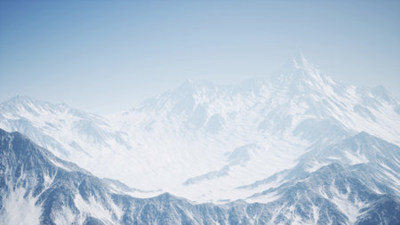 Vast range of snow clad mountains stretches across the horizon, illuminated by a clear blue sky. The tranquil landscape evokes a sense of peace and adventure in winter.の写真素材