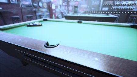 A lively pool hall, filled with energy, shows a close up view of a green felt pool table waiting for players. Soft lighting enhances the inviting atmosphere of friendly competition.の写真素材