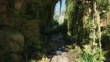 Sunlight cascades through a vibrant canyon filled with hanging vines and lush foliage. A serene stream meanders through the rocky path, inviting exploration in natures beauty.の写真素材