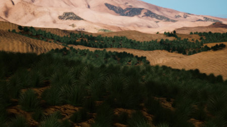 A stunning view of a desert landscape shows gentle rolling dunes alongside vibrant patches of greenery. The mountains rise majestically in the background under a clear blue sky.の写真素材