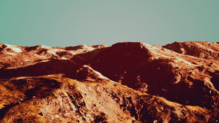 Rolling mountains reveal striking colors under a bright sky. Shadows dance across the rugged terrain, creating a breathtaking natural scene. The tranquility invites exploration and adventure.の写真素材