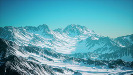 Vast wilderness unfolds with towering snow covered mountains against a brilliant blue sky. The serene beauty captures the essence of natures grandeur. Echoes of silence fill the air.の写真素材