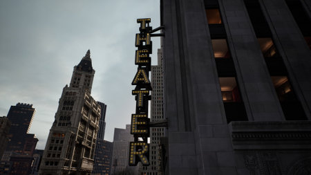 A vibrant theater sign glows against a gray sky, standing tall among modern and historic buildings. The scene captures the lively spirit of the city as evening approaches.の写真素材