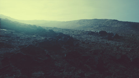 A rocky, uneven landscape stretches across the horizon under a soft, fading light. Shadows play...