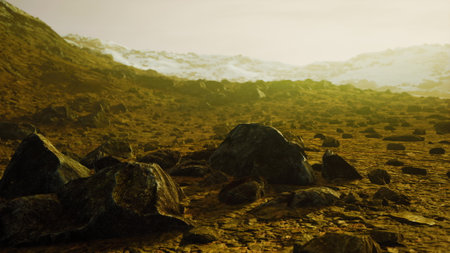 Rugged rocks scatter across a vast terrain, illuminated by a warm sun. Distant mountains rise softly under a hazy sky, creating a serene yet wild atmosphere of natures beauty.の写真素材