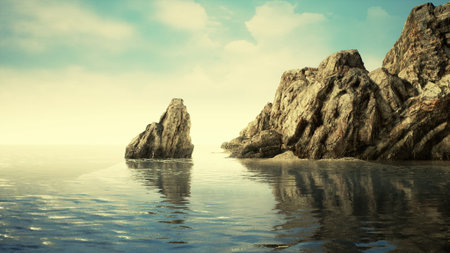 Calm waters reflect towering rock formations along a tranquil coastal scene. Soft light envelops the horizon as the sun sets, creating a peaceful atmosphere at the shore.の写真素材