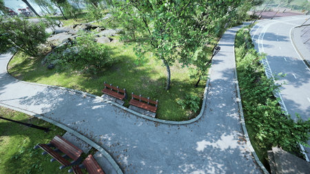 In a serene park, winding paths invite visitors to explore nature. Sunlight filters through green leaves, creating a peaceful atmosphere. Benches provide spots to relax and enjoy the scenery.の写真素材