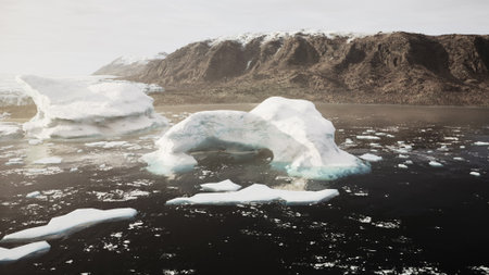 Giant icebergs drift gracefully in dark waters under soft light. The backdrop features towering...