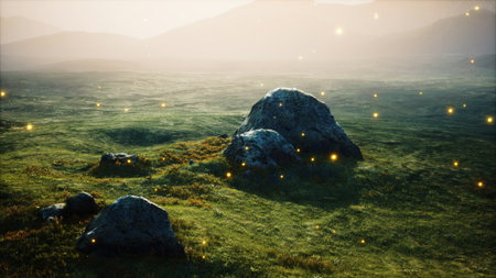 Vast meadow stretches under a soft morning glow, with large boulders dotting the landscape. Subtle glowing particles dance in the air, adding a magical touch to this serene natural setting.の写真素材
