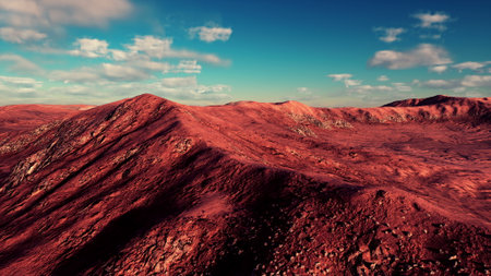 The landscape features rugged hills, bathed in warm hues under a stunning blue sky. The scene captures the serene beauty of nature at dusk, inviting reflection and exploration.の写真素材