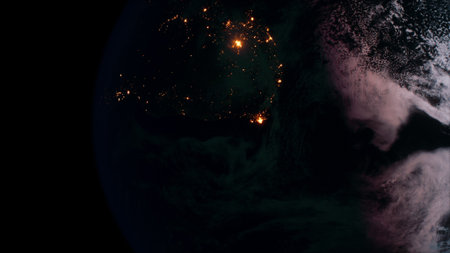 A stunning view of Earth from space reveals bright city lights shining against the dark backdrop of...
